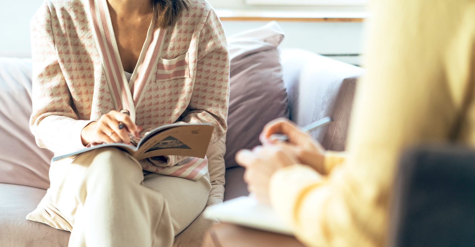 A cropped scene of two people in the midst of a discussion