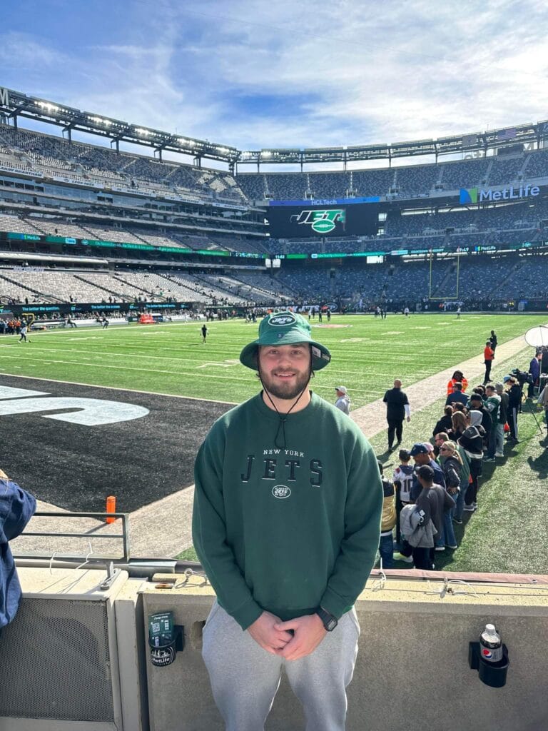 Calan Deuso, PA-C standing in MetLife Stadium