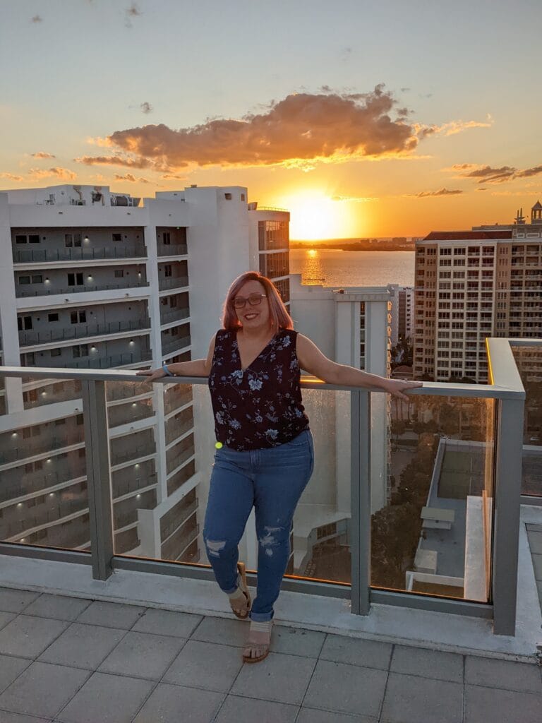 Samantha Herman, PNP standing before a scenic cityscape