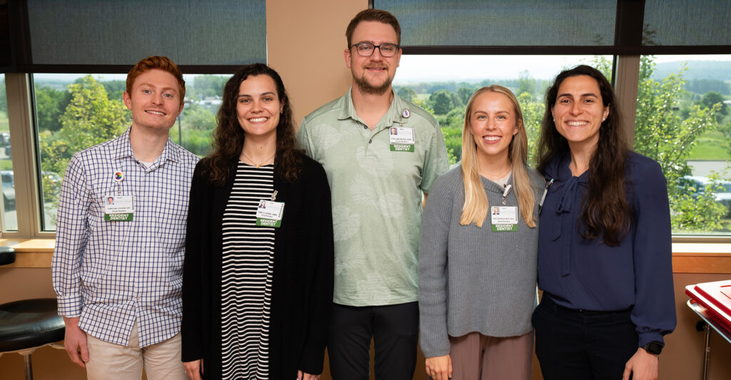 Five resident dentists smiling