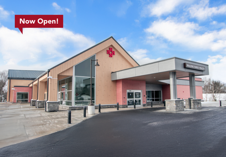 Exterior of Malone Family Health with a call-out that says 