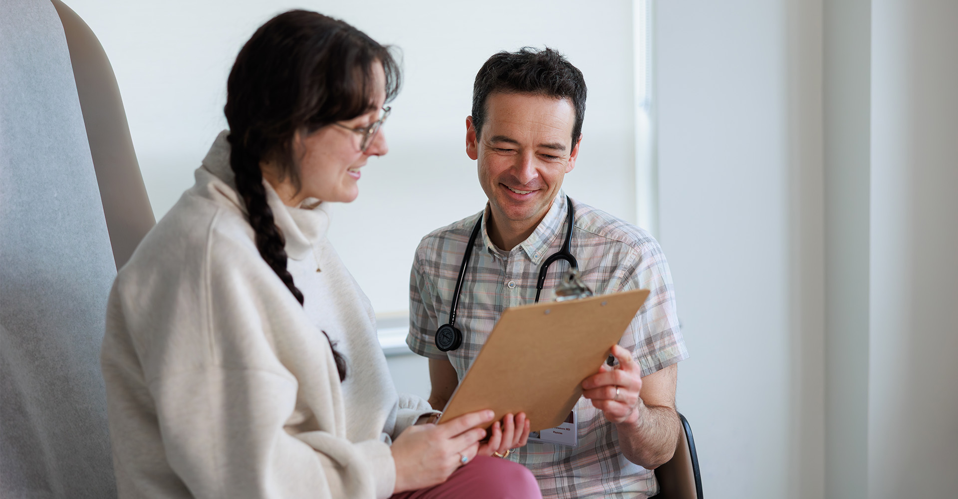Provider and patient looking at a clipboard