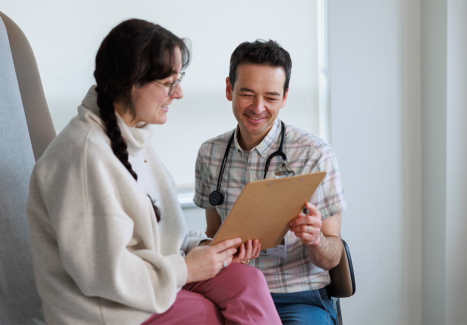 Provider and patient looking at a clipboard