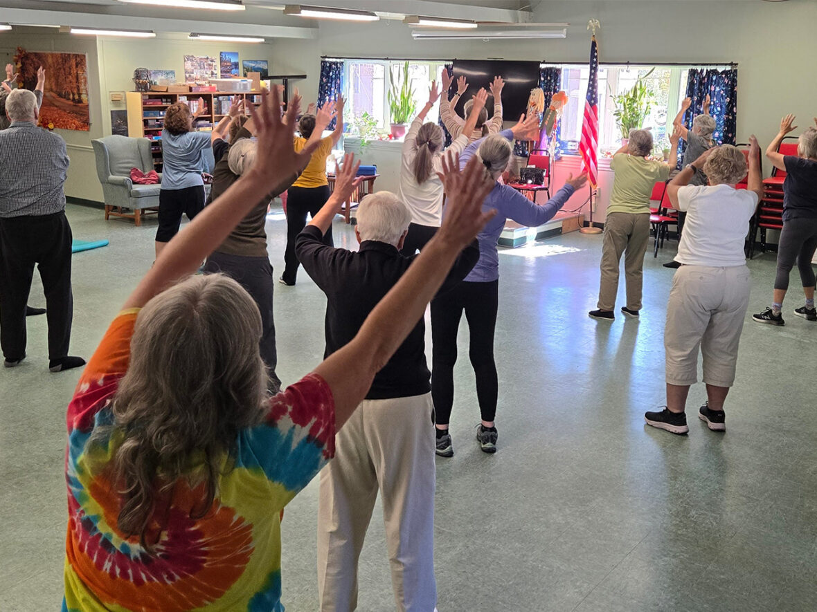 Group of older adults participating in a movement class